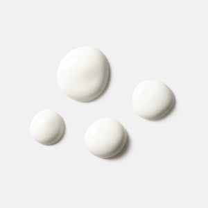 Four white serum droplets on a light background representing the texture of Solar Dew SPF Mineral Serum | HydroPeptide skincare product.