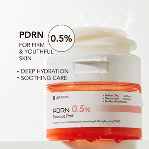 Open jar of PDRN 0.5% Essence Pad | Leaders with cream inside, water splashing around, highlighting deep hydration and soothing care for firm and youthful skin.