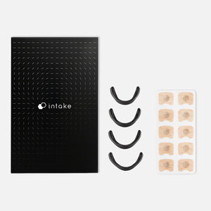 Black packaging with the Intake Nasal Strip Starter Kit - 15 Pack | Intake Breathing, including black nasal strips and beige adhesive pads for improved breathing and wellness.