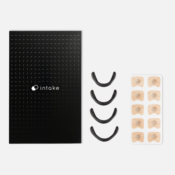 Black packaging with the Intake Nasal Strip Starter Kit - 15 Pack | Intake Breathing, including black nasal strips and beige adhesive pads for improved breathing and wellness.