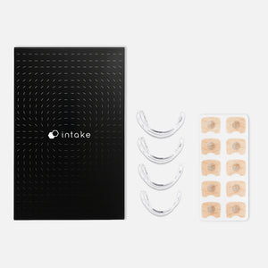 Intake Nasal Strip Starter Kit - 15 Pack | Intake Breathing featuring a sleek black box, four clear nasal strips, and a set of adhesive patches for nasal support and improved breathing wellness.