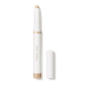 ColorLuxe Eye Shadow Stick | Jane Iredale in a soft, neutral shade with a smooth, creamy texture and a white cap beside the open makeup stick.