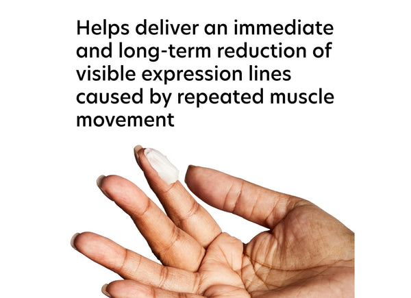 Hand applying a small amount of ExLinea Pro | PCA Skin cream onto the fingertip, highlighting its use for reducing visible expression lines caused by muscle movement.