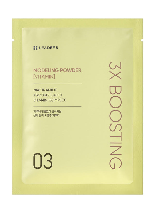 Front view of a pale yellow packet featuring 3X Boosting Modeling Mask - Vitamin | Leaders with key ingredients niacinamide, ascorbic acid, and vitamin complex for skincare.