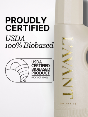 Close-up of a beige laundry detergent bottle with gold "L'AVANT Collective" branding alongside a USDA 100% Biobased certification label and text stating proudly certified.