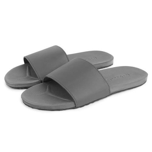 Gray spa and shower slides designed for comfort and ease, featuring a wide strap and textured footbed for relaxation and wellness, Spa/Shower Slide | Feelgoodz.