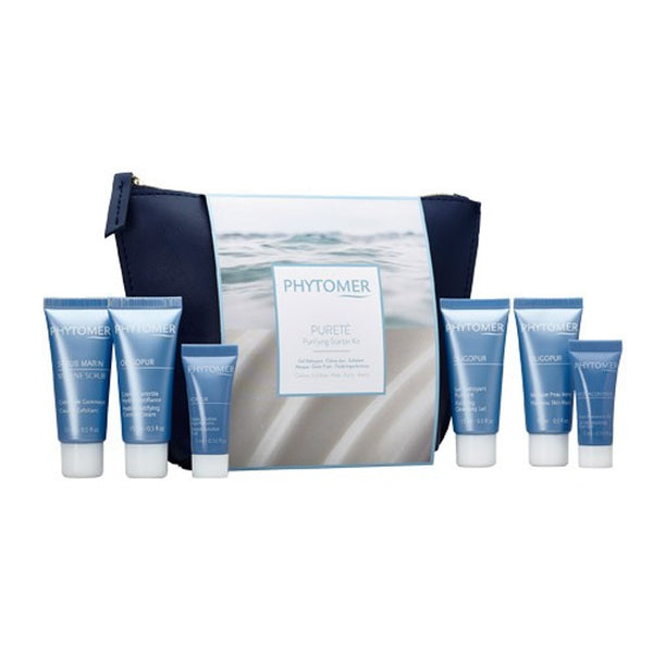 Travel-sized skincare tubes and a navy blue and white pouch for the Purifying Starter Kit | Phytomer, featuring cleansing and purifying products for skincare routines.