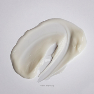 Creamy texture of Soothing Body Lotion | Alchimie Forever spread on a white surface, highlighting its moisturizing skincare benefits for body care.