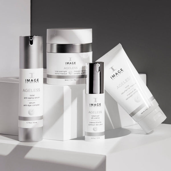 AGELESS total eye lift crème | IMAGE Skincare displayed among complementary skincare products in clean white and silver packaging on a bright background highlighting wellness and self-care.