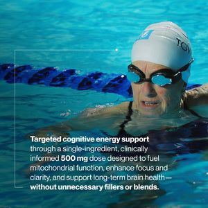 An older adult woman swimming in a pool wearing a white swim cap and blue goggles, promoting Acetyl L-Carnitine as targeted cognitive energy support for enhanced focus and long-term brain health.