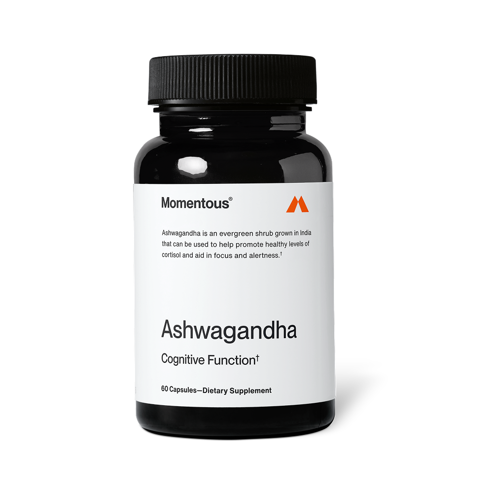 Bottle of Ashwagandha dietary supplement by Momentous, designed to support cognitive function and promote healthy cortisol levels for wellness and focus.