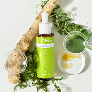 BIOME+ dew bright serum | IMAGE Skincare bottle with natural plant ingredients and dropper, highlighting skincare and wellness product in a clean, bright setting.