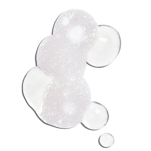 Clear gel texture with foamy bubbles representing the Glowing Greens Detoxifying Facial Cleansing Gel | COOLA for skincare and cleansing routines.