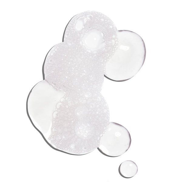 Clear gel texture with foamy bubbles representing the Glowing Greens Detoxifying Facial Cleansing Gel | COOLA for skincare and cleansing routines.
