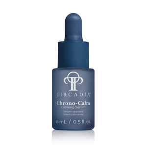 Blue glass dropper bottle of Chrono-Calm | Circadia calming serum for skincare, featuring a minimalist design and 15 mL size, promoting wellness and skin recovery.