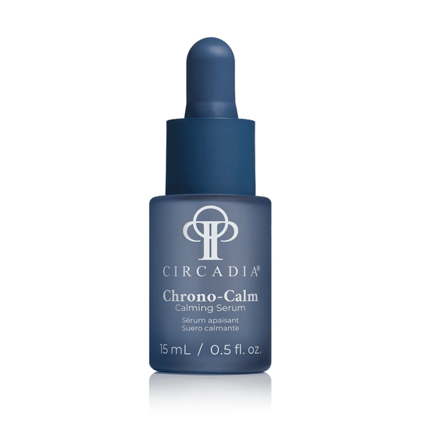 Blue glass dropper bottle of Chrono-Calm | Circadia calming serum for skincare, featuring a minimalist design and 15 mL size, promoting wellness and skin recovery.