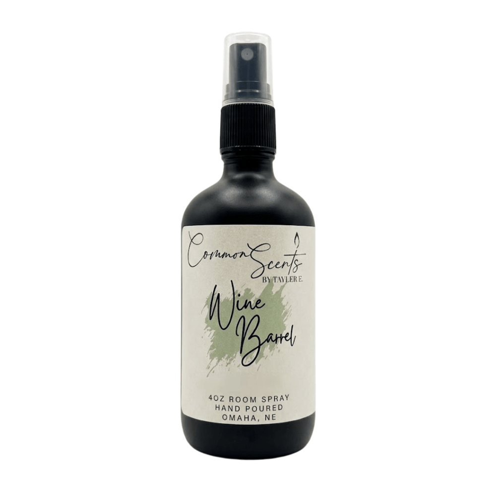 4oz Luxury Room Spray | CommonScents by Tayler E featuring a sleek black bottle with a spray nozzle and a minimalist label for a sophisticated wine barrel scent.