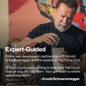 Arnold Schwarzenegger preparing a wellness supplement shake with Fiber+ 10-Travel Packs, promoting gut health and daily wellness support.