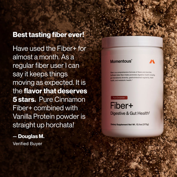 Container of Fiber+ digestive and gut health supplement in pure cinnamon flavor placed on a surface sprinkled with cinnamon powder, accompanied by a customer testimonial praising its taste and effectiveness.