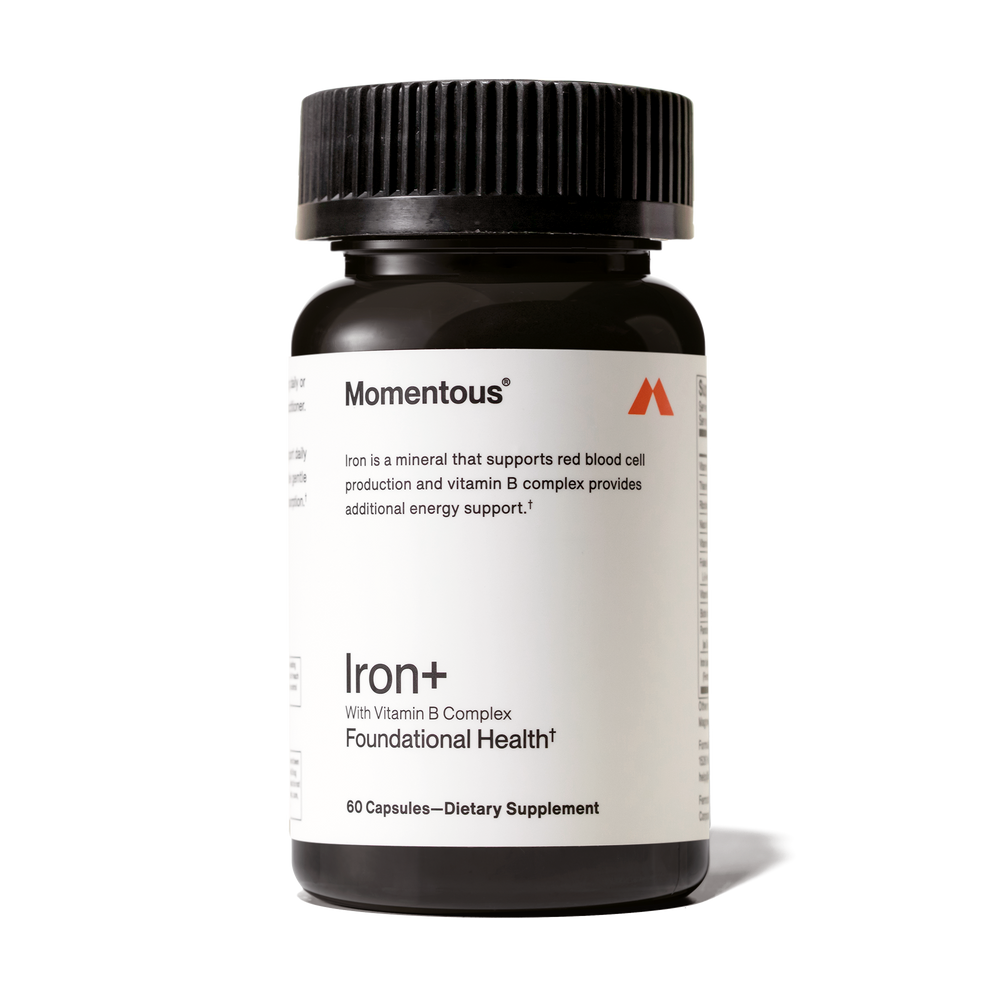 Dark amber bottle of Iron+ dietary supplement with Vitamin B Complex for foundational health and energy support, featuring a black ribbed cap.