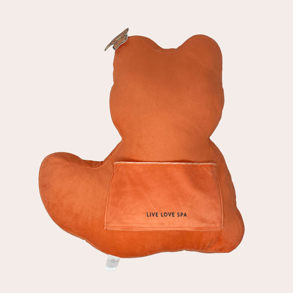 Back view of the Meditating Fox Plushie | Lucky Owl in soft orange fabric with a small pocket embroidered with Live Love Spa, designed for comfort and wellness décor.