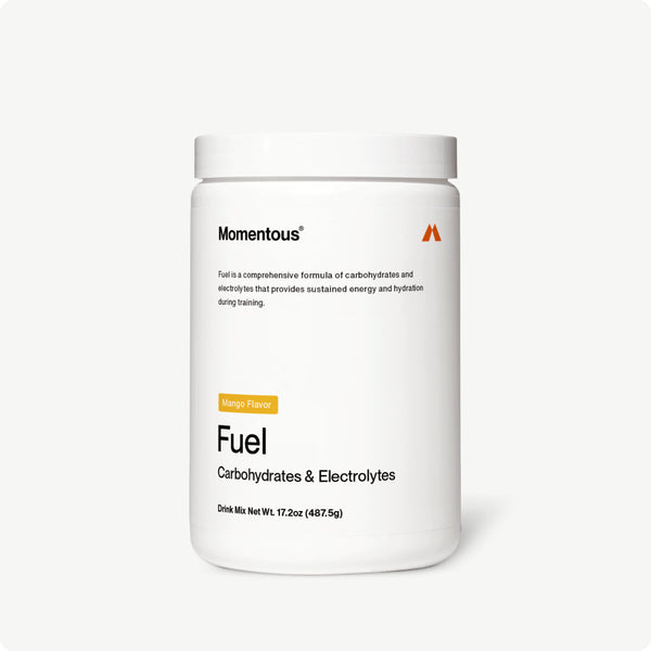White jar of Fuel mango flavored carbohydrate and electrolyte drink mix by Momentous for hydration and sustained energy during training