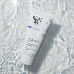 Hydra No. 1 Masque Sleep Gel Mask | Yon-Ka Paris in a white tube lying on rippling water surface, emphasizing hydration and skincare benefits with a clean, refreshing background.