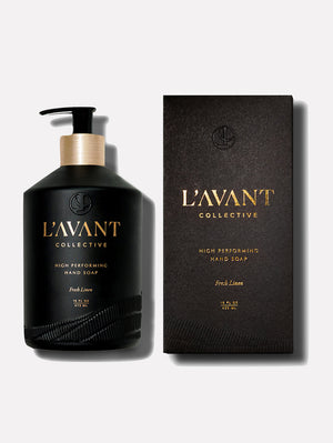 Bottle and box packaging of High Performing Hand Soap - Fresh Linen | L'AVANT Collective in sleek black design with gold lettering, showcasing skincare product.