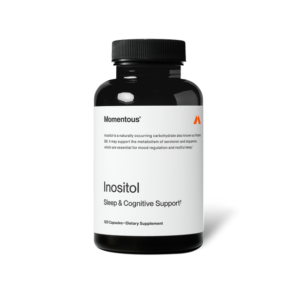 A black bottle of Inositol dietary supplement by Momentous featuring sleep and cognitive support, designed for wellness and mood regulation.