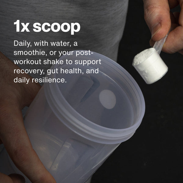 Person holding a scoop of L-Glutamine powder above a clear shaker cup with dosage instructions for daily use to support recovery, gut health, and resilience.