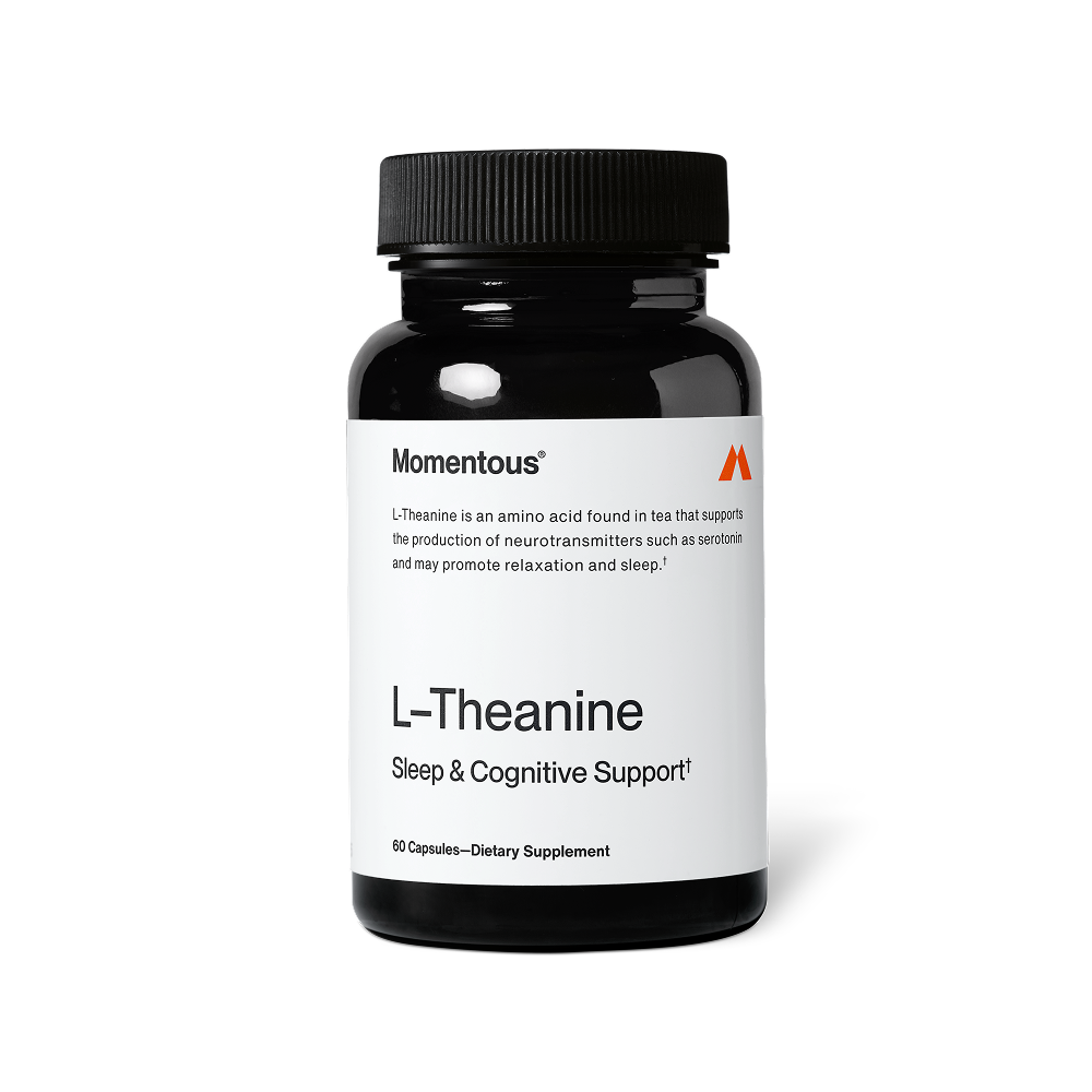 Black bottle of L-Theanine dietary supplement capsules for sleep and cognitive support with a white label and black lid