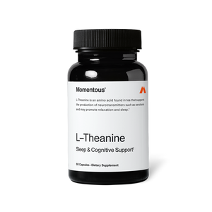 Black bottle of L-Theanine dietary supplement capsules for sleep and cognitive support with a white label and black lid