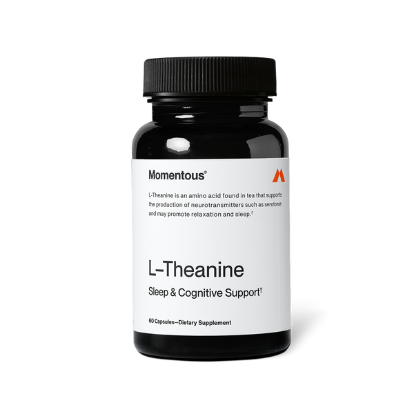 Black bottle of L-Theanine dietary supplement capsules for sleep and cognitive support with a white label and black lid