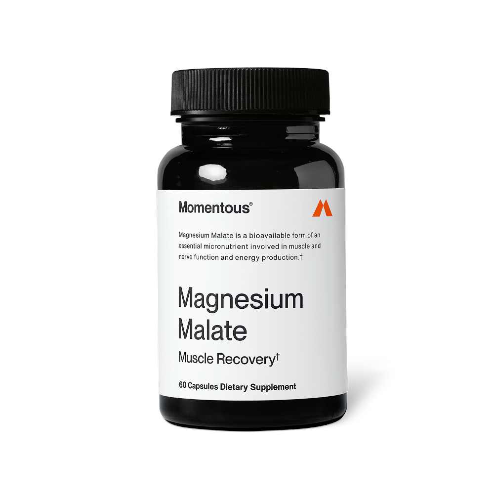 Black bottle of Magnesium Malate dietary supplement capsules designed for muscle recovery and energy, featuring a simple white label with clear text.
