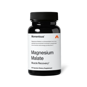 Black bottle of Magnesium Malate dietary supplement capsules designed for muscle recovery and energy, featuring a simple white label with clear text.