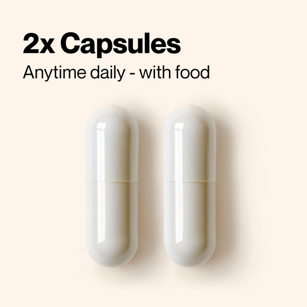 Two white capsules of Magnesium Malate displayed on a light background with text indicating the recommended daily dosage of two capsules taken anytime with food.