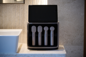MediSpa Pro | Ceragem sleek wellness device with four handheld body care tools displayed in an elegant bathroom setting for advanced skincare and recovery.