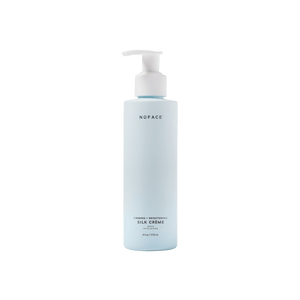 Bottle of Firming + Brightening Silk Crème | NuFACE, a skincare product in a light blue pump dispenser designed for firming and brightening the skin.