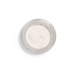 Top view of creamy white skincare product in a clear jar from the Silky, Milky & Most Loved Naked Nourishment Set | Farmhouse Fresh, showcasing smooth texture for body care and wellness.