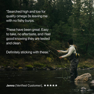 Person fly fishing in a forested river setting with a customer review praising the Omega-3 Travel Packs for being easy to take, no aftertaste, and tested for quality and cleanliness.
