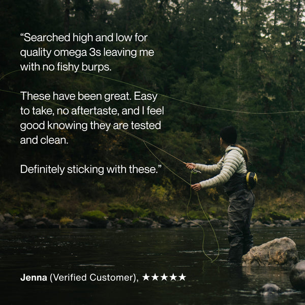 Person fly fishing in a forested river setting with a customer review praising the Omega-3 Travel Packs for being easy to take, no aftertaste, and tested for quality and cleanliness.