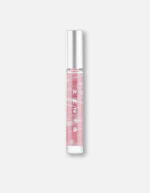 Attar Roll-on Scent | Zents in a sleek glass vial with silver cap, featuring a soft pink label designed for convenient body care and wellness use.
