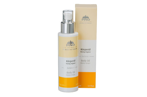 Body Oil | Pino Spa Therapy bottle with pump dispenser and matching beige and orange packaging, featuring honey ginger scent for skincare and body care wellness.