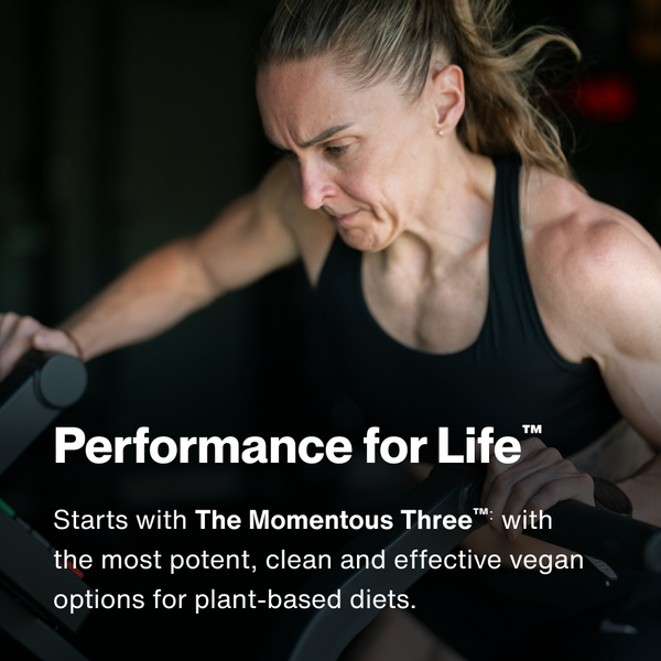 Athletic woman intensely working out on fitness equipment, promoting The Momentous Three - Vegan plant-based wellness supplements for performance and recovery.