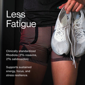 Close-up of a person wearing athletic shorts holding white running shoes, promoting Rhodiola Rosea as a wellness supplement that supports energy, focus, and stress resilience.