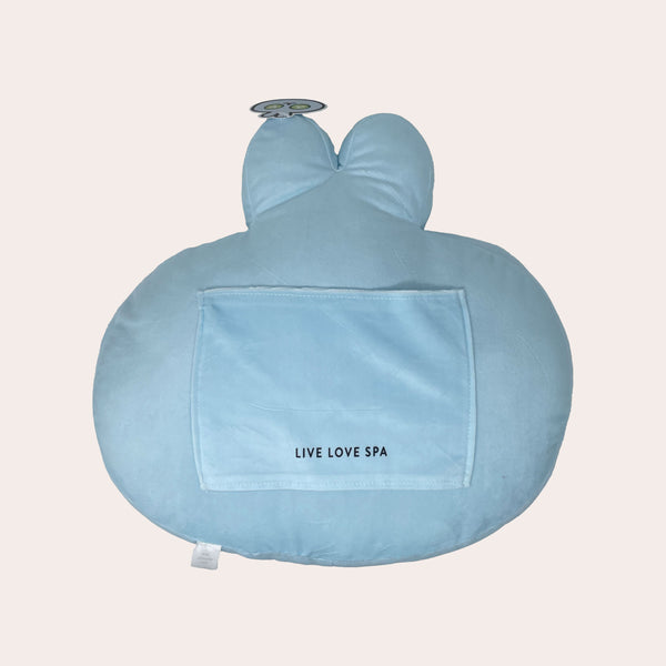 Soft blue plush cushion shaped like a bunny with a pocket labeled Live Love Spa, designed for comfort and wellness support, Spa Bunny Plushie | Lucky Owl.