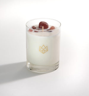 Sensual Glass Candle | Aluminate Life with white wax in a clear glass holder, decorated with polished stones on top for a soothing, elegant wellness ambiance.