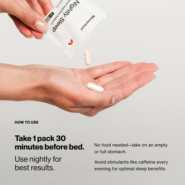 Hand holding two capsules with a Nightly Sleep 30-Pack packet being poured, illustrating how to take one pack 30 minutes before bed for optimal wellness supplement use.