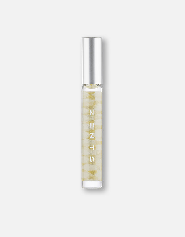 Clear glass roll-on bottle with a silver cap containing a golden liquid, featuring subtle patterns and labeled Attar Roll-on Scent | Zents for body care and wellness.