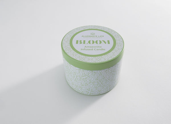 Bloom Candle Tin 6 oz | Aluminate Life with a light green lid and geometric patterned white container, designed for wellness and relaxation ambiance.